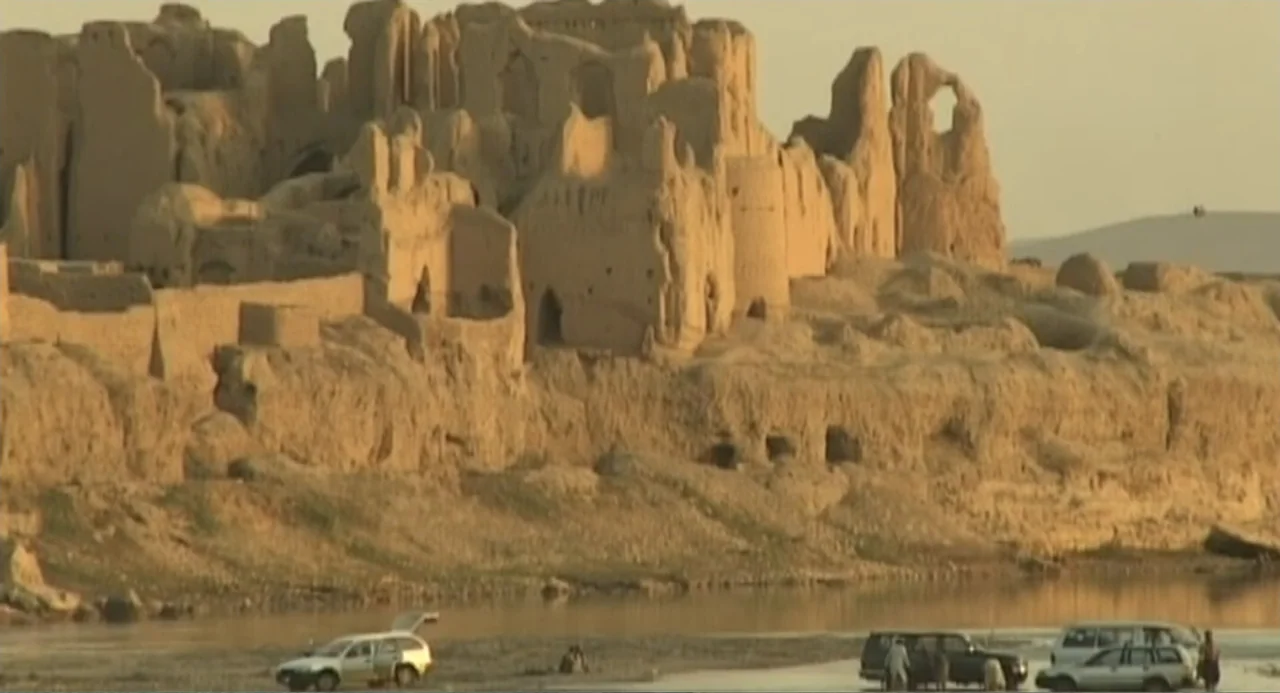 Afghanistan's Opium Trail (2007) movie still: establishing — A sprawling set of ancient sun-baked mud brick ruins sits atop a high ridge. Several…