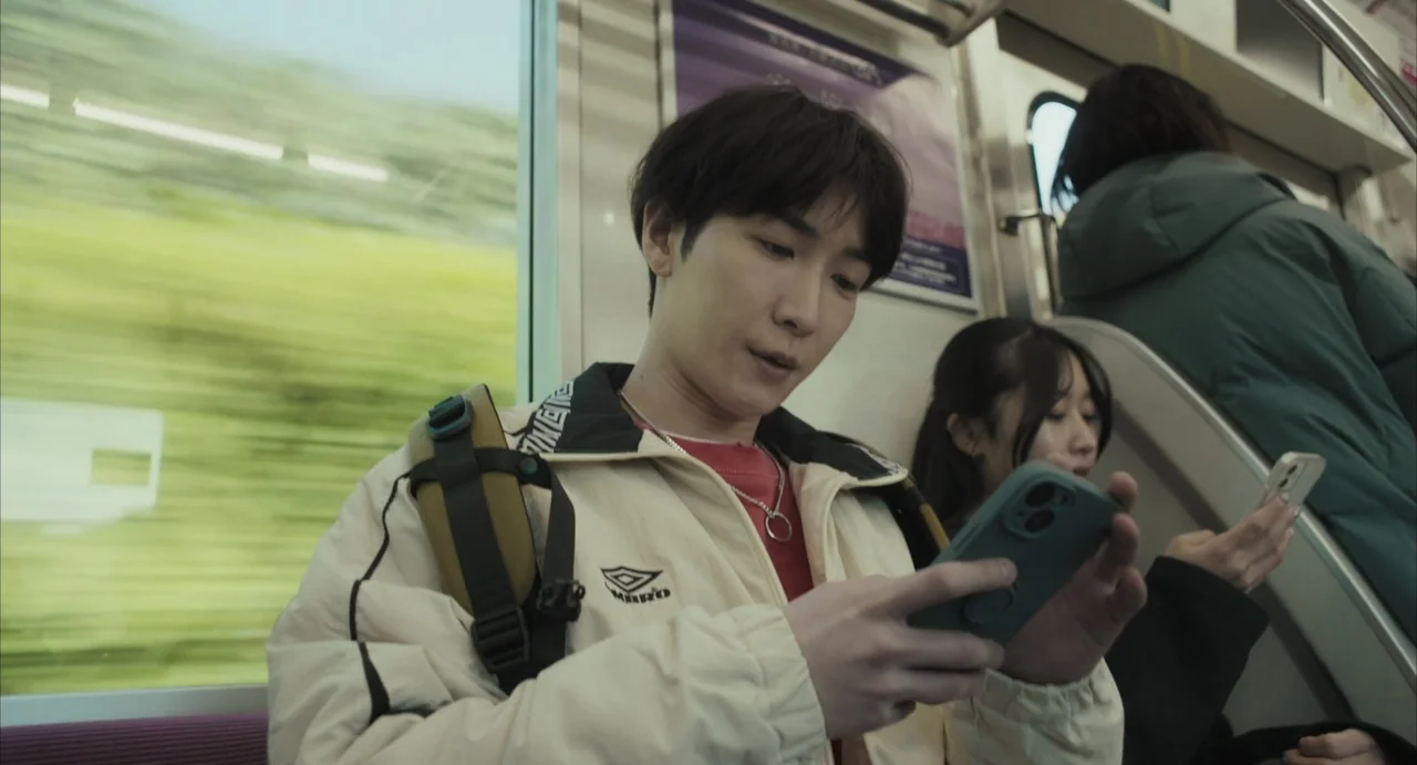 Stigmatized Properties: Possession (2025) movie still: medium — The interior of a moving subway car features metal handrails and blurred green…