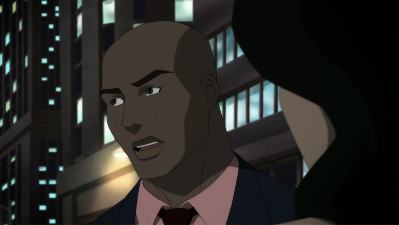 Reign of the Supermen (2019) movie still: medium — A city street at night features illuminated windows of distant buildings. A man in a suit speaks…