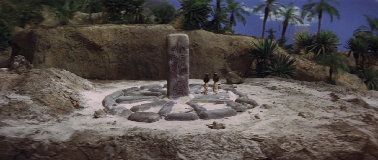 Ebirah Horror of the Deep (1966) movie still: wide — A miniature desert landscape features a central stone monolith surrounded by a circular stone…