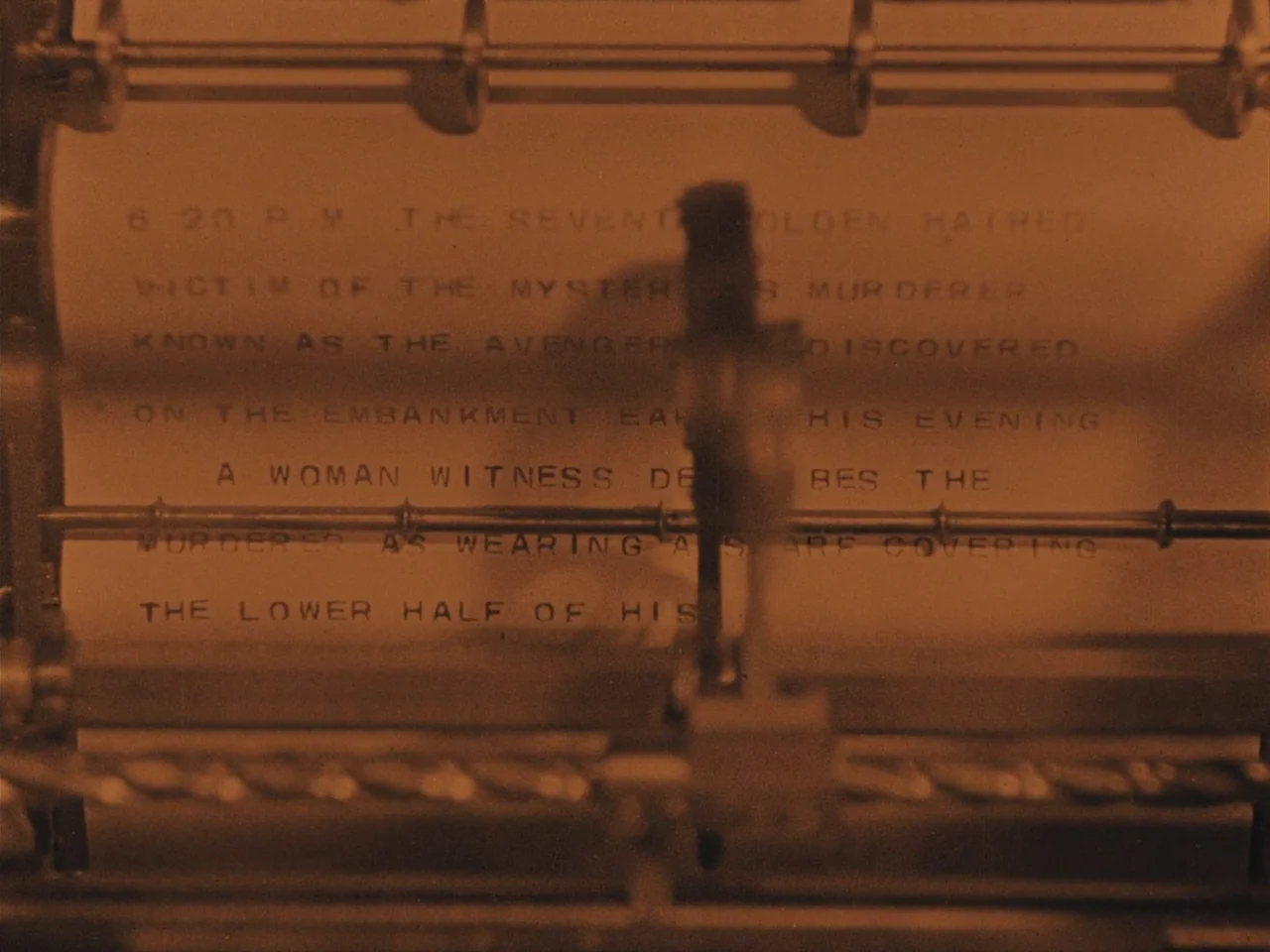 The Lodger (1927) movie still: closeup — A close-up view of a typed document inside a vintage typewriter. The paper contains text describing a…
