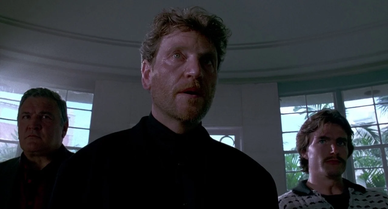 Bad Boys (1995) movie still: medium — A group of three men stand in a sunroom with large windows behind them. They are positioned in front of the…