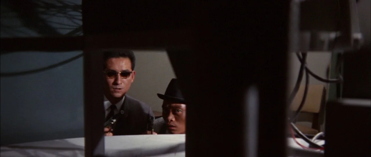 Ghidorah The Three Headed Monster (1964) movie still: medium — An interior technical room contains complex electronic equipment and tangled dark…