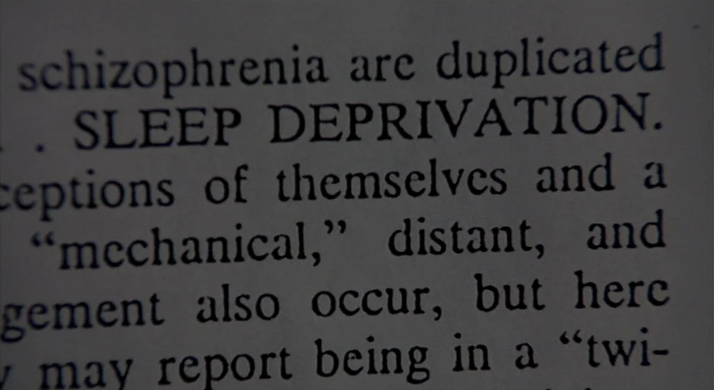 New Nightmare (1994) movie still: closeup — A close-up shot of printed text on a paper surface. Several lines of English text are visible, including…