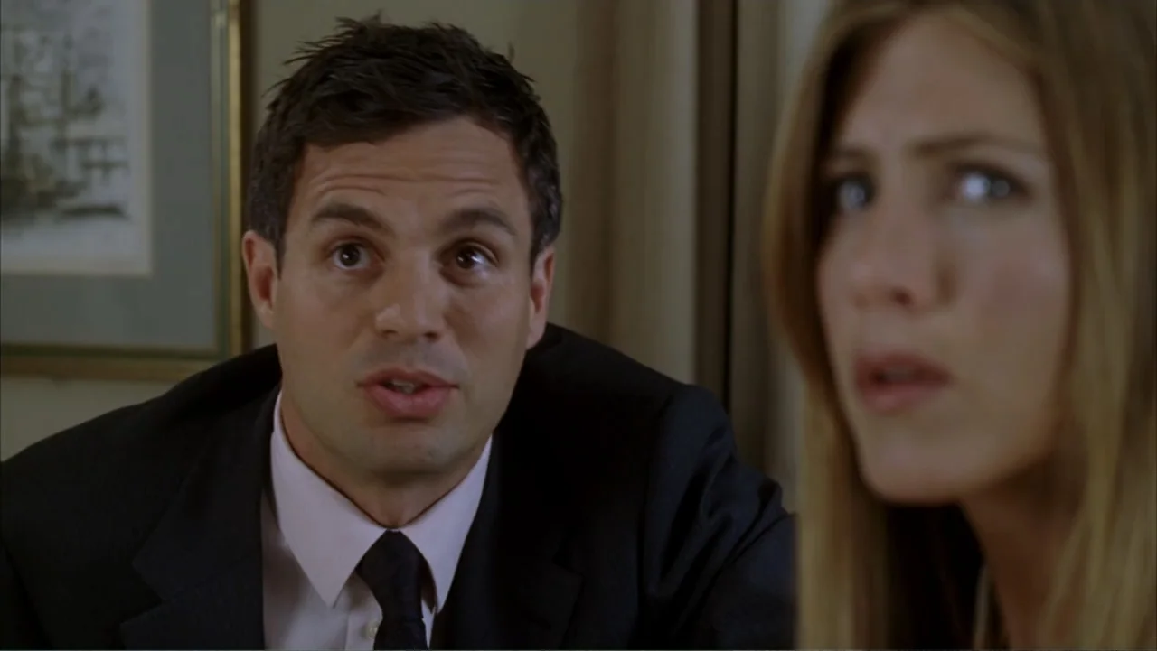 Rumor Has It... (2005) movie still: medium — An interior space with a beige wall featuring a framed picture in the background. A man in a suit…