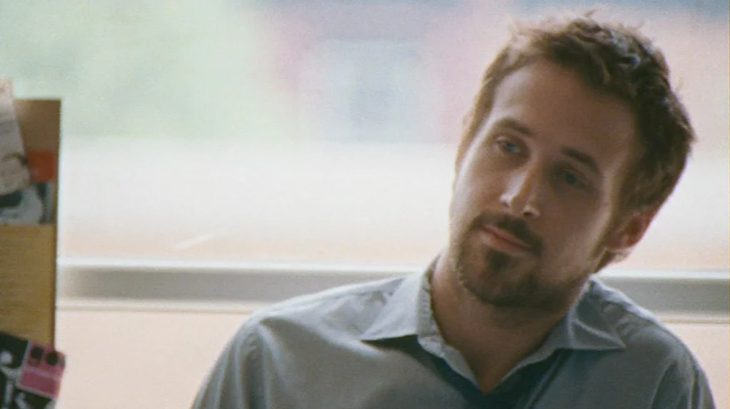 Half Nelson (2006) movie still: closeup — A bright, daylit interior space with a window providing backlight. A man with short brown hair and a…