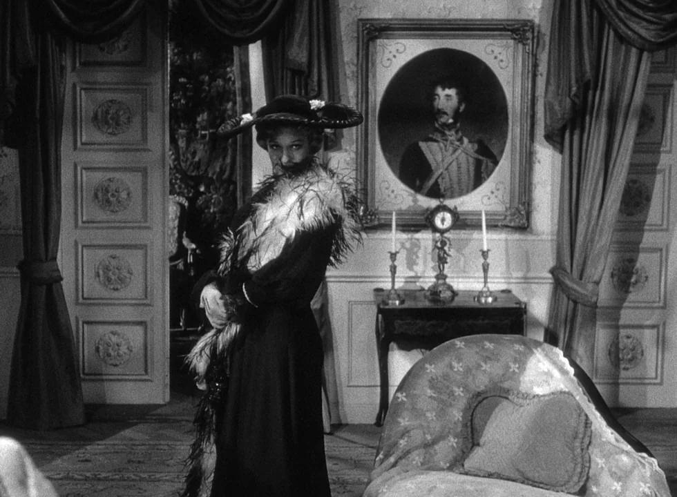 Smiles Of A Summer Night (1955) movie still: fullbody — A well-appointed historic parlor with paneled walls, ornate curtains, and a framed portrait.…