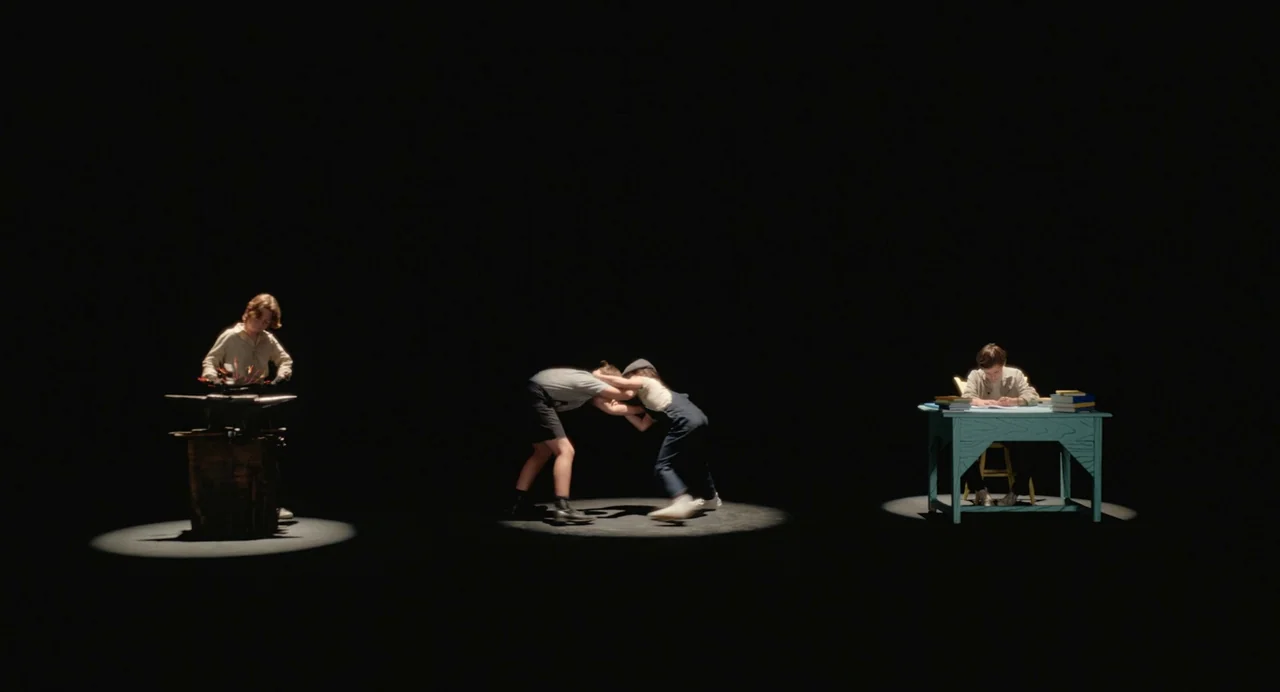 Beau Is Afraid (2023) movie still: wide — A dark empty void contains three isolated circles of light on the ground. Three children perform separate…