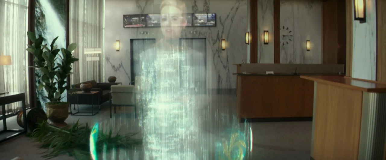 Hotel Artemis (2018) movie still: wide — A spacious lobby featuring marble walls and a sleek reception desk with modern furnishings. A bright…