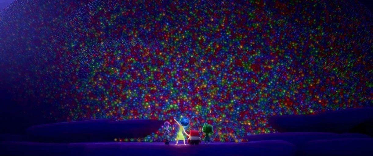 Inside Out 2 (2024) movie still: wide — A vast, dark expanse contains an immense mountain of glowing, multicolored spherical memory orbs. Four…