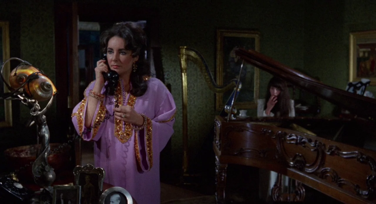 Secret Ceremony (1968) movie still: medium — An opulent, dark parlor filled with vintage furniture, a harp, and a grand piano. A woman in a purple…