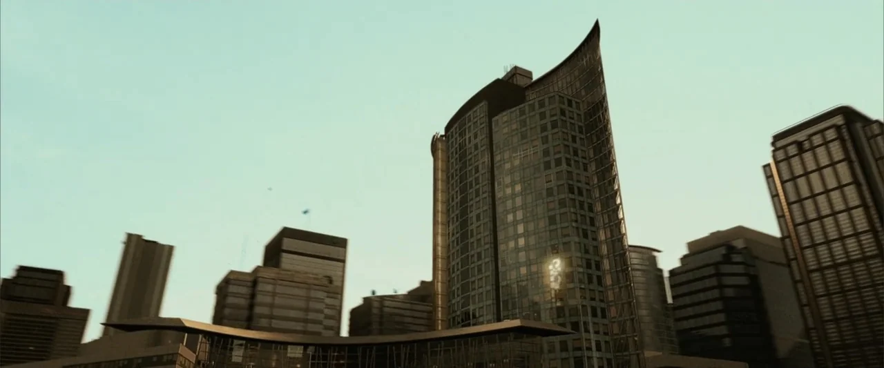 Catwoman (2004) movie still: establishing — A dense urban environment features several modern skyscrapers with glass and metal surfaces. The…
