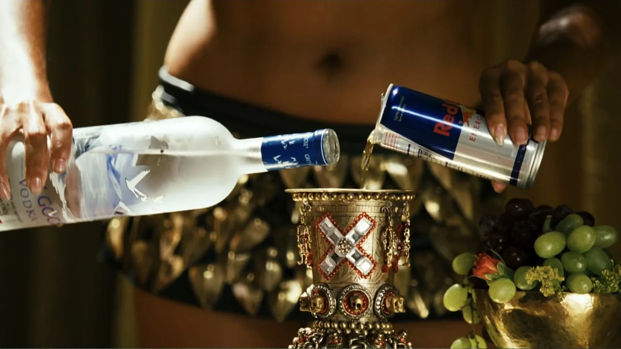 Meet the Spartans (2008) movie still: medium — A person pours drinks into an ornate jeweled chalice decorated with skull carvings. The subject's…