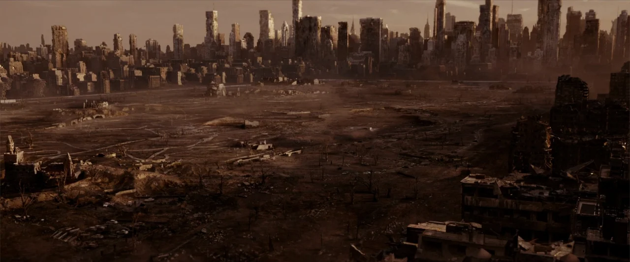 Breathe (2011) movie still: establishing — A vast, barren wasteland stretches toward the crumbling remains of a major city skyline. The desolate…