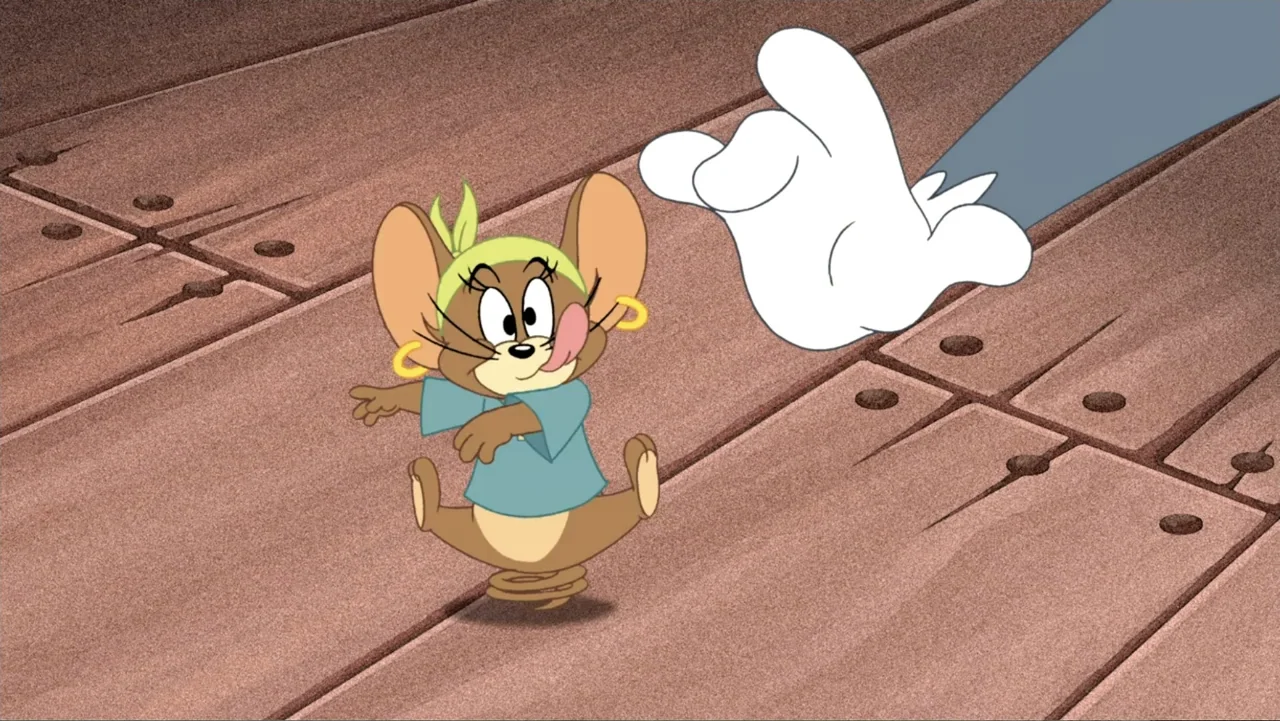 Tom and Jerry: Shiver Me Whiskers (2006) movie still: medium — A wooden floor surface provides the backdrop for a cartoon interaction. A small…