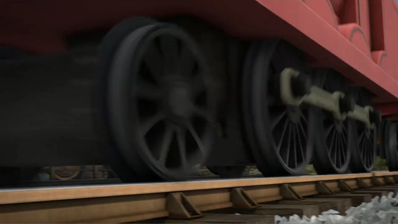 Thomas & Friends: Tale of the Brave (2014) movie still: medium — A close view shows the rotating black wheels of a red steam locomotive. The train…