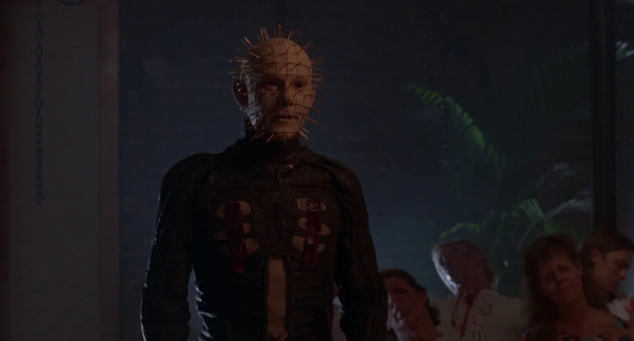 Hellraiser III: Hell on Earth movie still: medium — A dimly lit club interior with blurred patrons visible in the low-light background. A central…