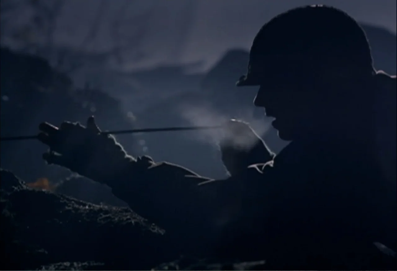 When Trumpets Fade (1998) movie still: medium — A dark, dirt-filled trench exists at night under moonlight with visible ground textures. A soldier…