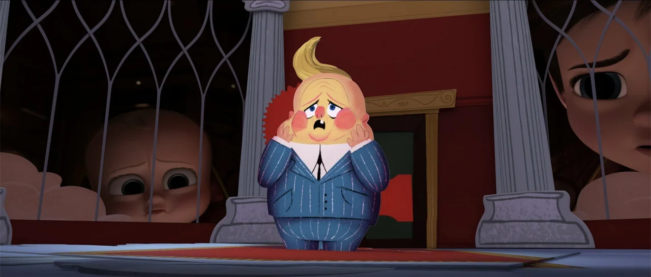 The Boss Baby (2017) movie still: medium — A stylized interior space features decorative pillars and red walls. A small boy in a business suit…