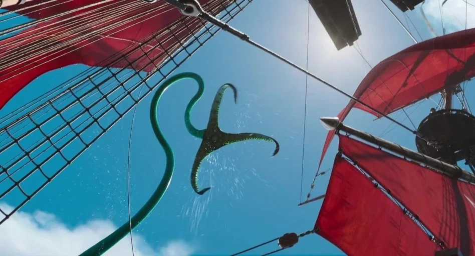 The Sea Beast (2022) movie still: wide — The perspective looks up from the deck of a vessel with bright red sails. A long green tentacle curves…