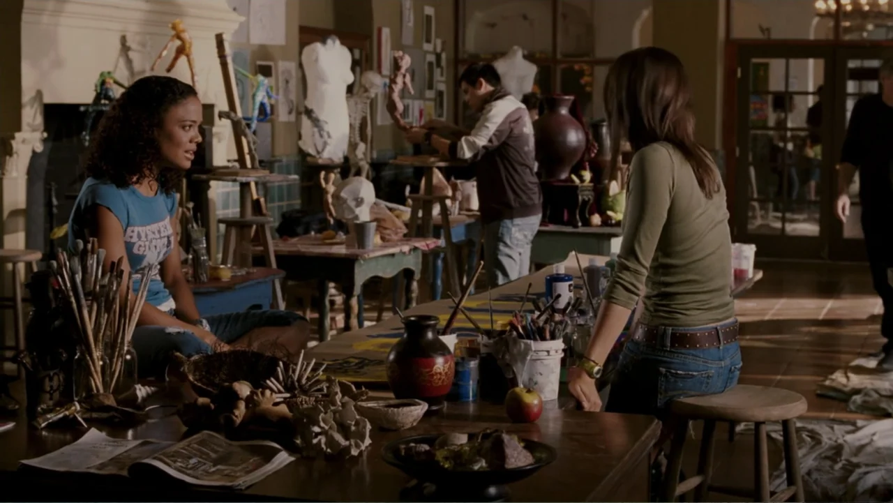 When a Stranger Calls (2006) movie still: medium — A cluttered school art room features tables covered with paintbrushes, clay sculptures, and…
