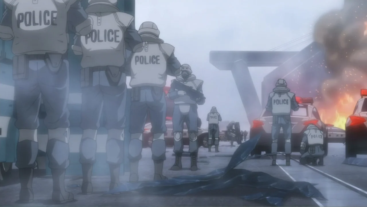Ghost in the Shell: The New Movie (2015) movie still: wide — A group of police officers stand on a hazy concrete overpass near burning vehicles.…