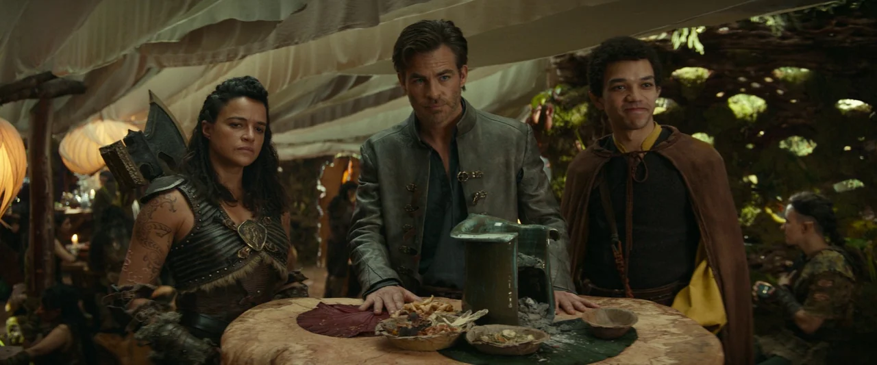 Dungeons & Dragons: Honor Among Thieves (2023) movie still: medium — A rustic interior setting features draped ceiling fabric and warm wooden…