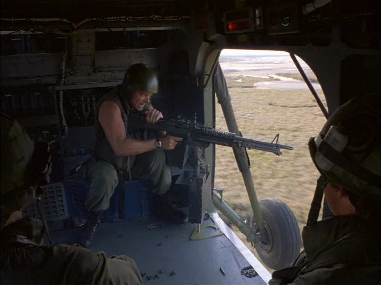 Full Metal Jacket (1987) movie still: medium — A military transport aircraft interior features dark metallic walls and a large open doorway. A…