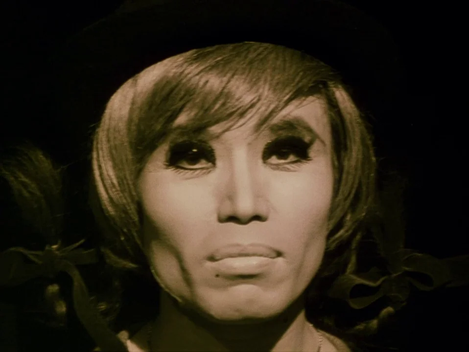 Throw Away Your Books, Rally in the Streets (1971) movie still: closeup — A dark, empty space surrounds a person against a black background. The…