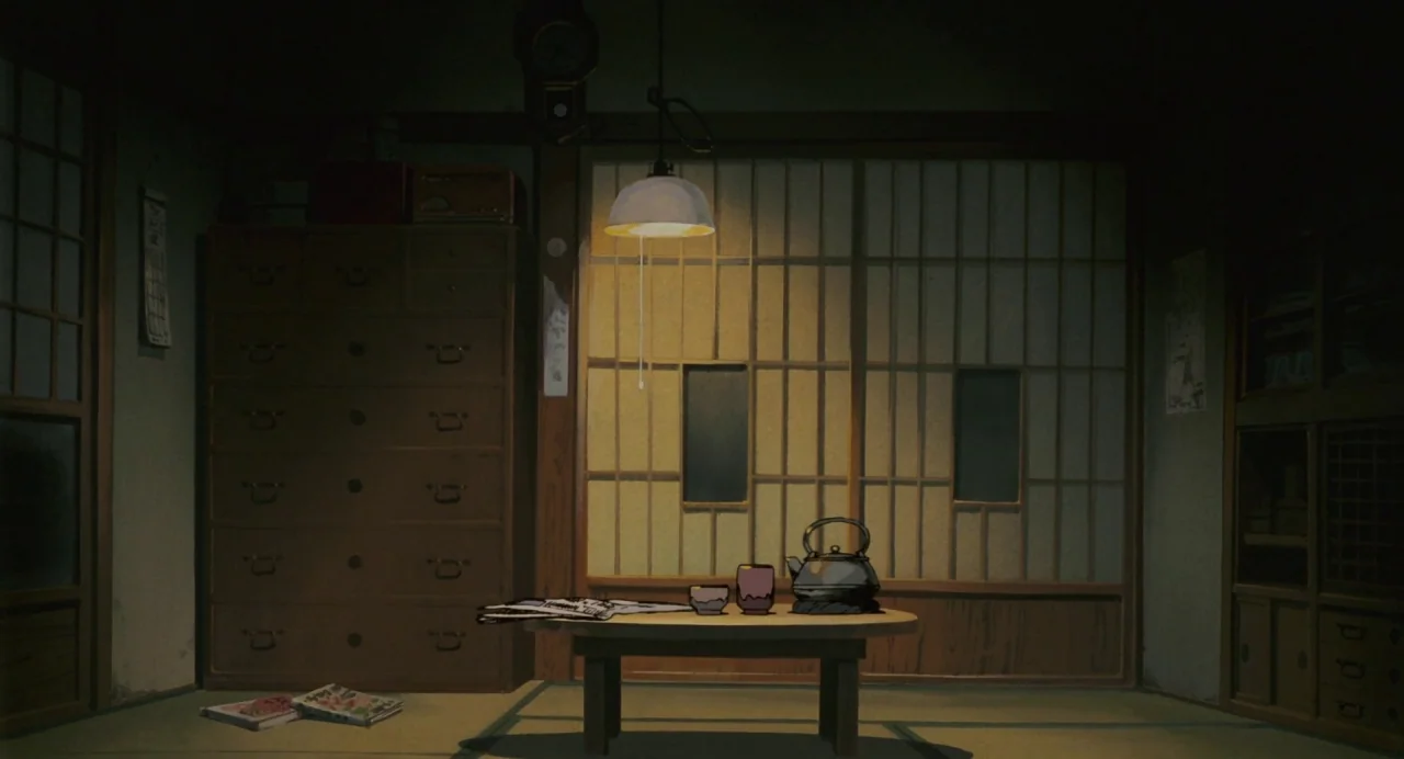 My Neighbour Totoro (1988) movie still: establishing — A traditional Japanese room features a low table, sliding paper doors, and wooden cabinetry.…