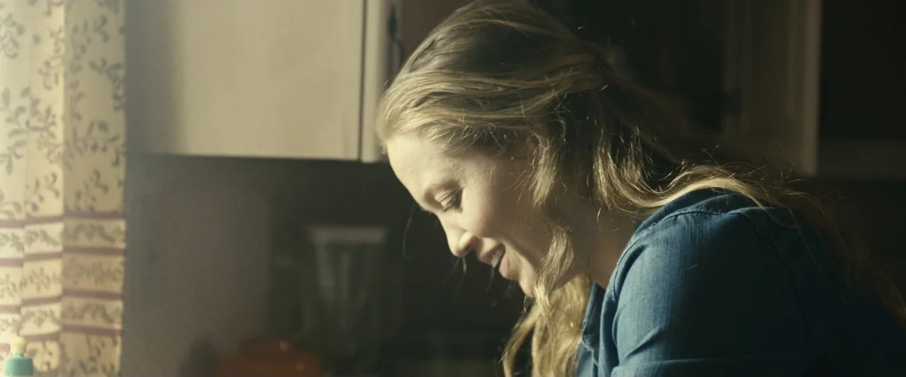 The Case for Christ (2017) movie still: closeup — A residential kitchen with light colored walls and patterned window curtains. A woman stands in…