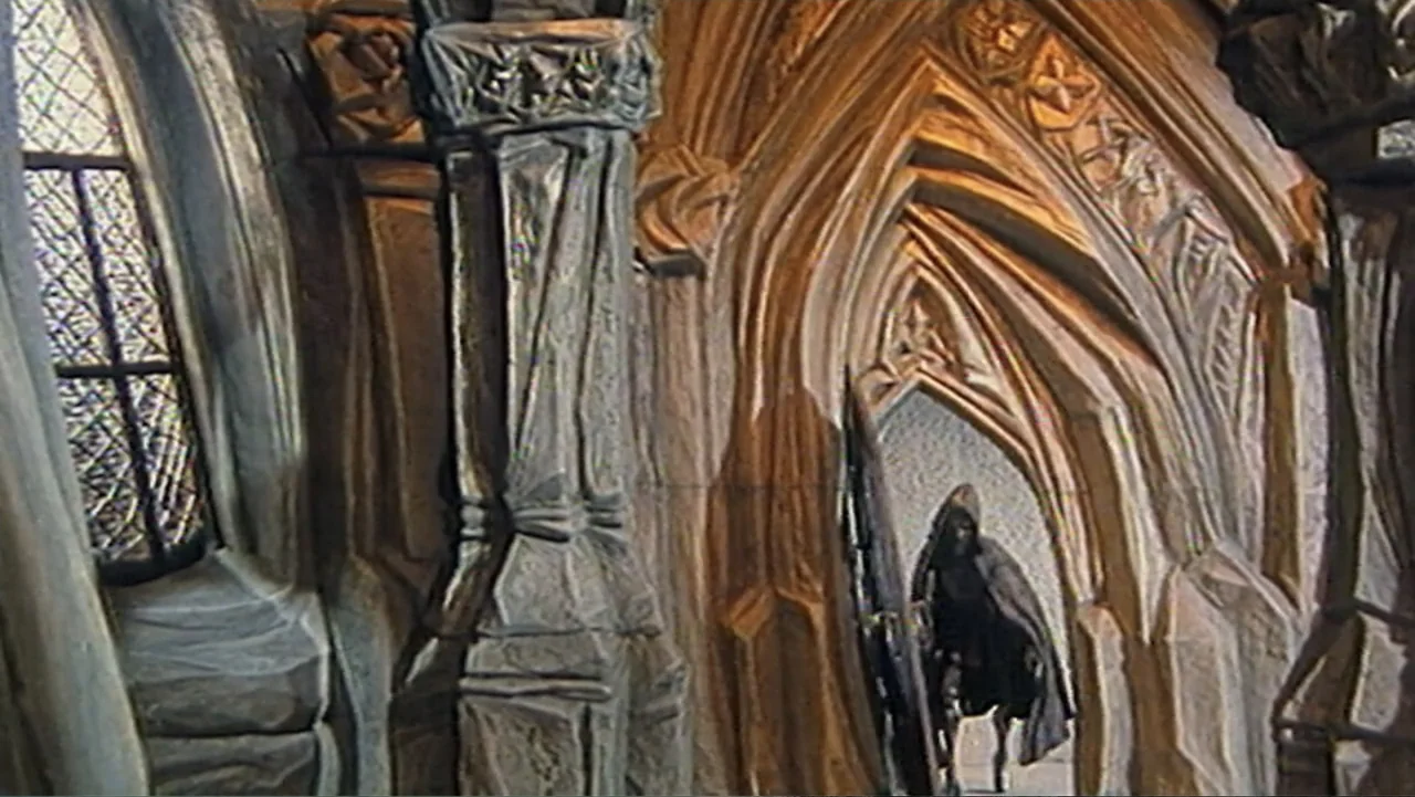 Beware the Slenderman (2016) movie still: wide — A stone cathedral corridor features ribbed vaulting and intricate carved pillars in a gothic style.…
