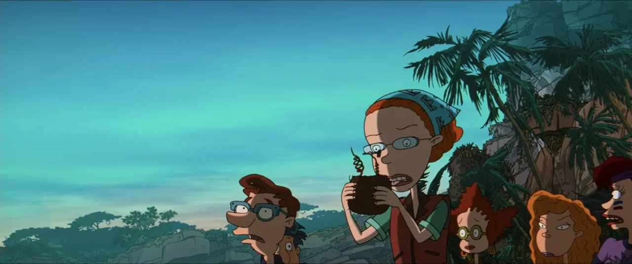 Rugrats Go Wild (2003) movie still: medium — A group of people is standing outdoors near tropical vegetation at dusk. The characters look ahead…