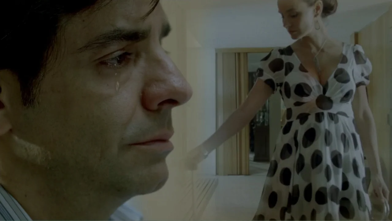 George Lopez: It's Not Me, It's You (2012) movie still: closeup — A residential hallway features white walls and a glimpse into an adjacent room. A…