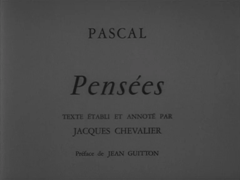 My Night At Maud’s (Ma Nuit Chez Maud) (1969) movie still: closeup — A dark gray title card displays white printed text centered in the frame. The…