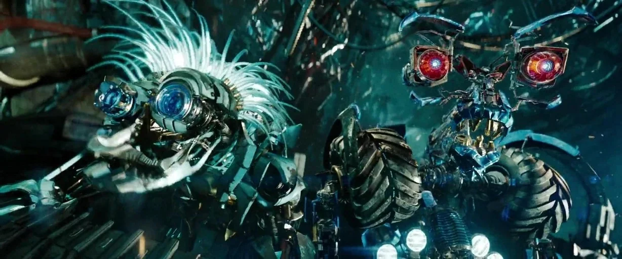 Transformers: Dark of the Moon (2011) movie still: medium — A dark, cramped mechanical environment filled with tangled wires and metallic debris.…