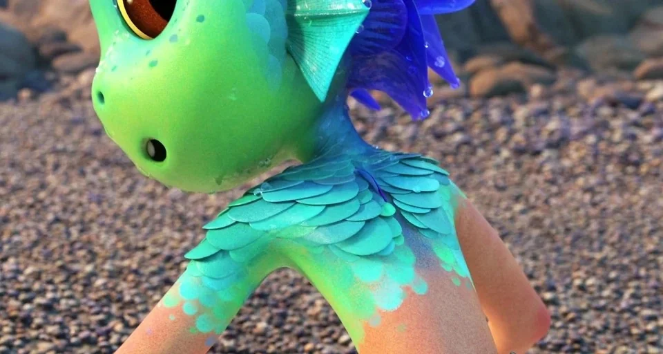 Luca (2021) movie still: closeup — A close view of a green sea creature with scales and fins on a beach. The character moves across a surface…