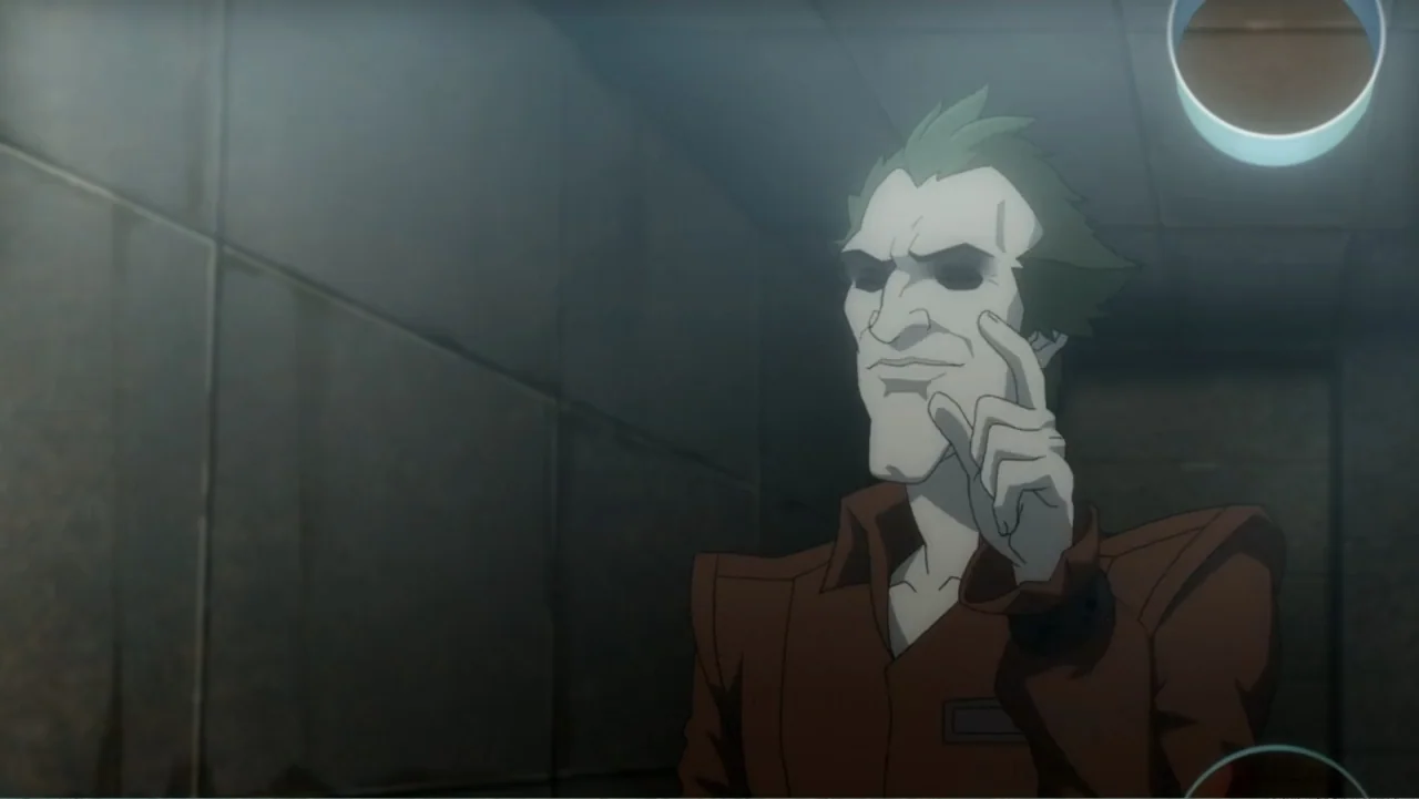 Batman: Assault on Arkham (2014) movie still: medium — A dimly lit room with industrial grey paneled walls and a single overhead light source. A…