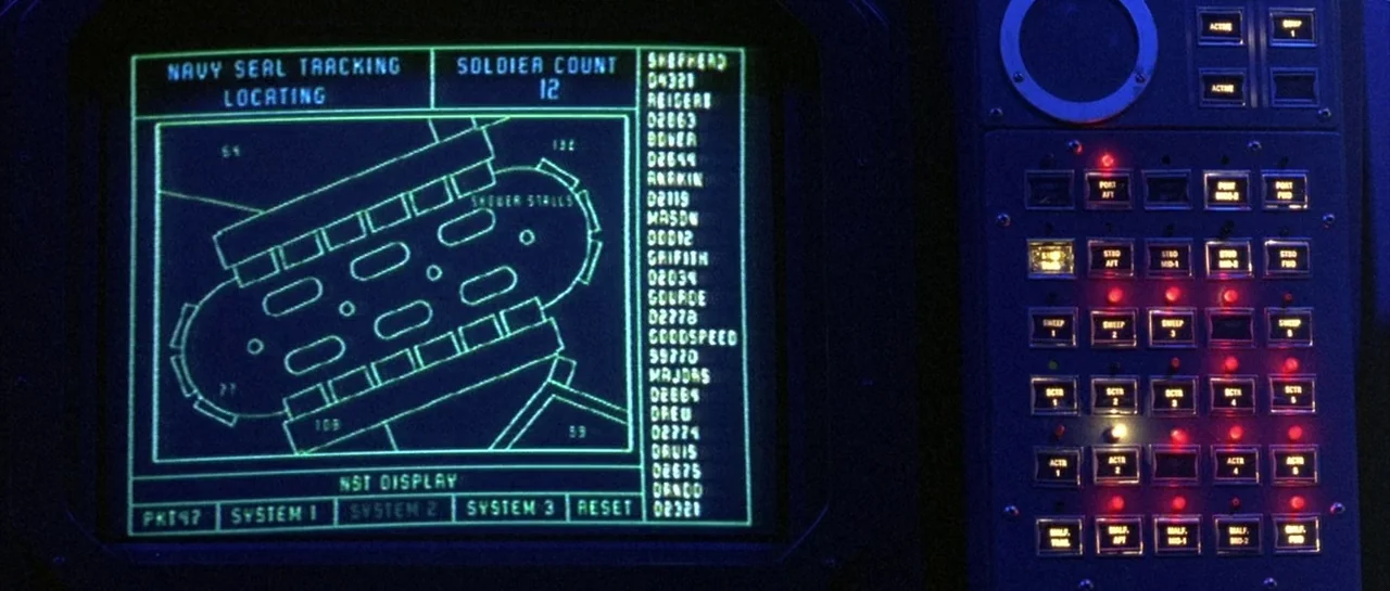 The Rock (1996) movie still: closeup — A dark, complex naval console displays a tactical tracking interface with green line graphics. The screen…