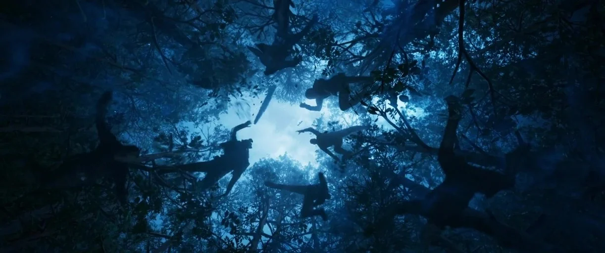 Guardians of the Galaxy Vol. 2 (2017) movie still: wide — A dense forest canopy is visible from below against a bright, hazy moonlit sky. Several…