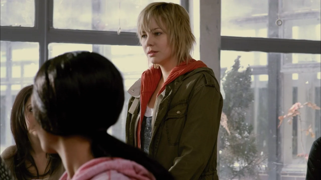 Silent Hill: Revelation 3D (2012) movie still: medium — A well-lit room with large windows features a blonde woman standing near the glass. She…