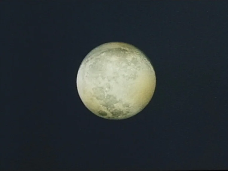 Salome (1972) movie still: closeup — A full moon is centered against a dark, featureless night sky. The celestial body displays visible lunar…