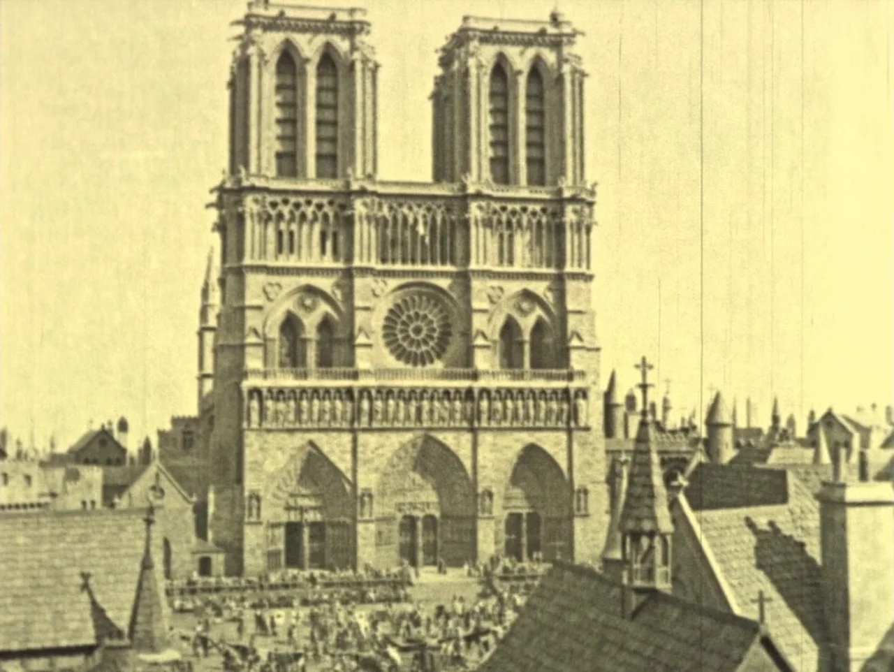 The Hunchback of Notre Dame (1923) movie still: establishing — The stone cathedral facade dominates the center of a bustling city square. Many small…