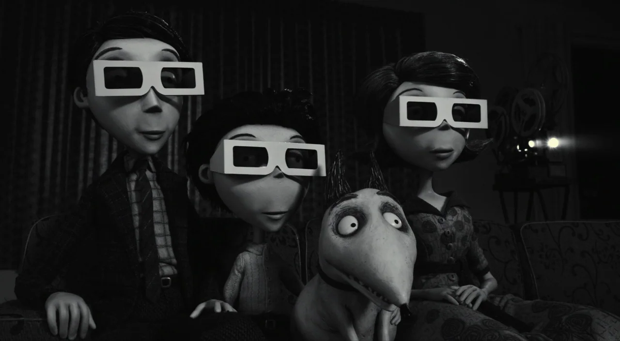 Frankenweenie (2012) movie still: medium — A 1950s interior with three puppet figures and a dog sitting on a sofa. They watch a film as the…