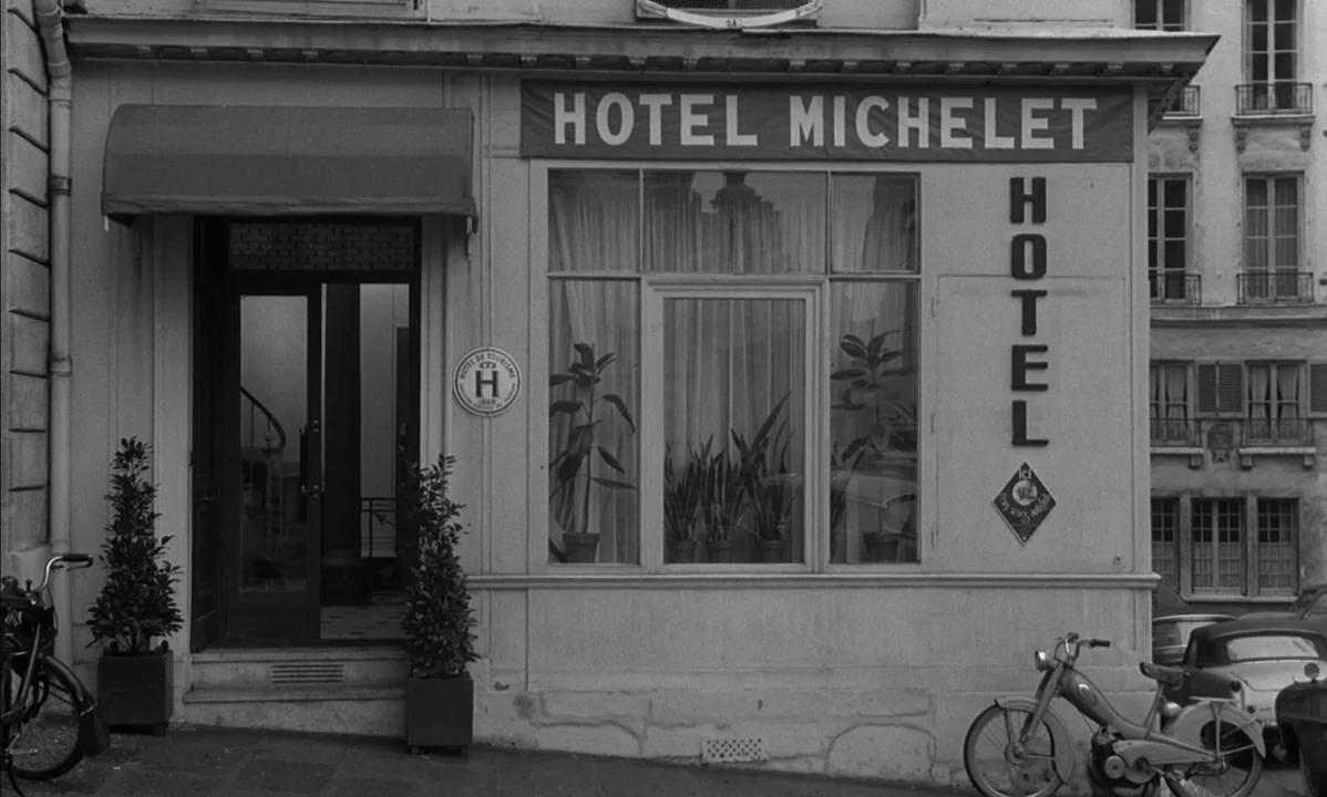 La Peau Douce (The Soft Skin) (1964) movie still: wide — A classic French hotel facade features a sign reading Hotel Michelet above large windows.…