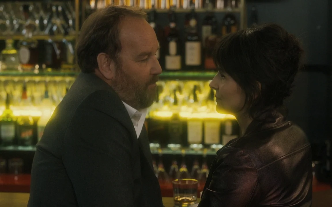 Let The Sunshine In (2017) movie still: medium — A dimly lit bar setting with backlit shelves displaying various liquor bottles. A man and a woman…
