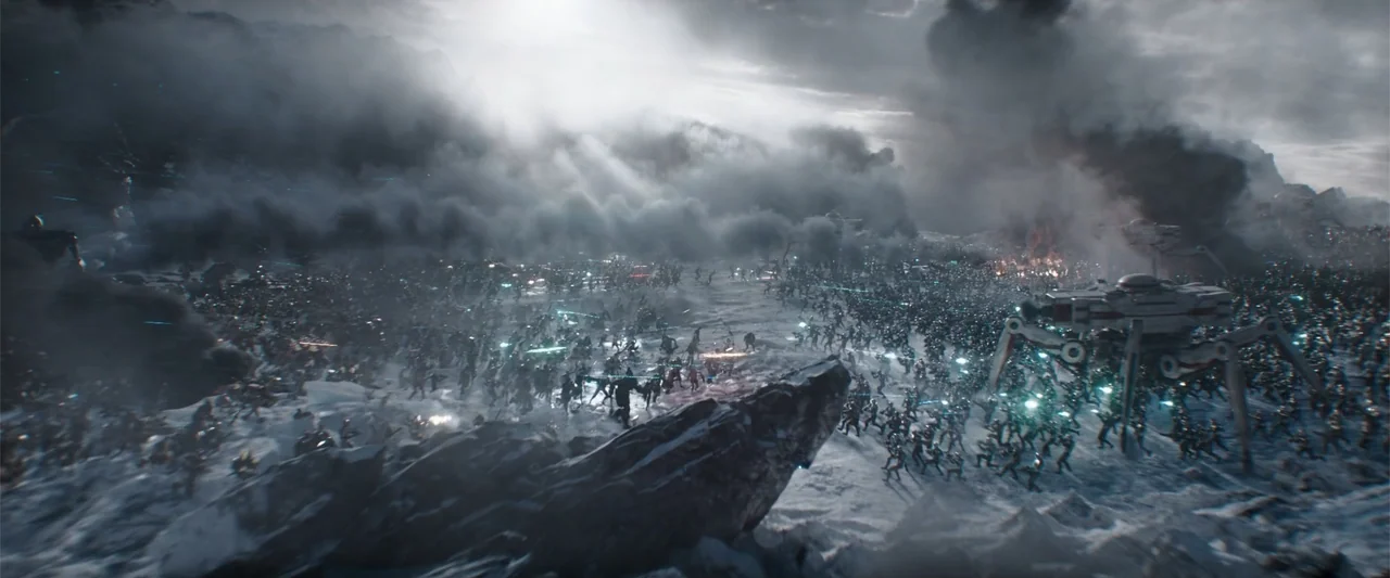 Ready Player One (2018) movie still: wide — A sprawling sci-fi battlefield covered in snow and thick smoke under an overcast sky. Two massive…