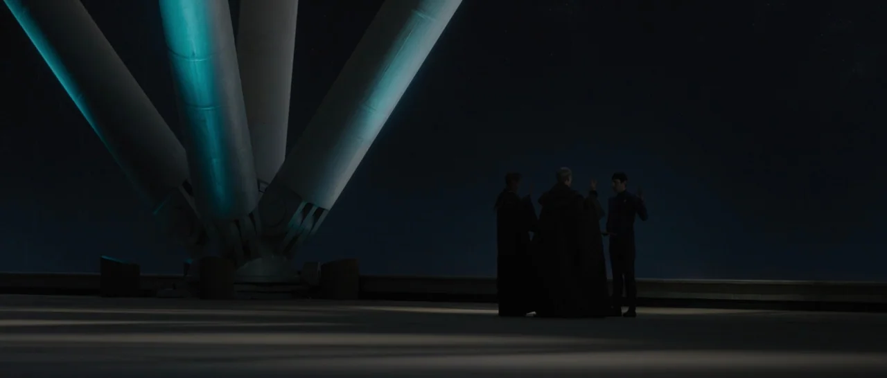 Star Trek Beyond (2016) movie still: wide — An open observation platform sits beneath a night sky with a massive structural pillar. Three…