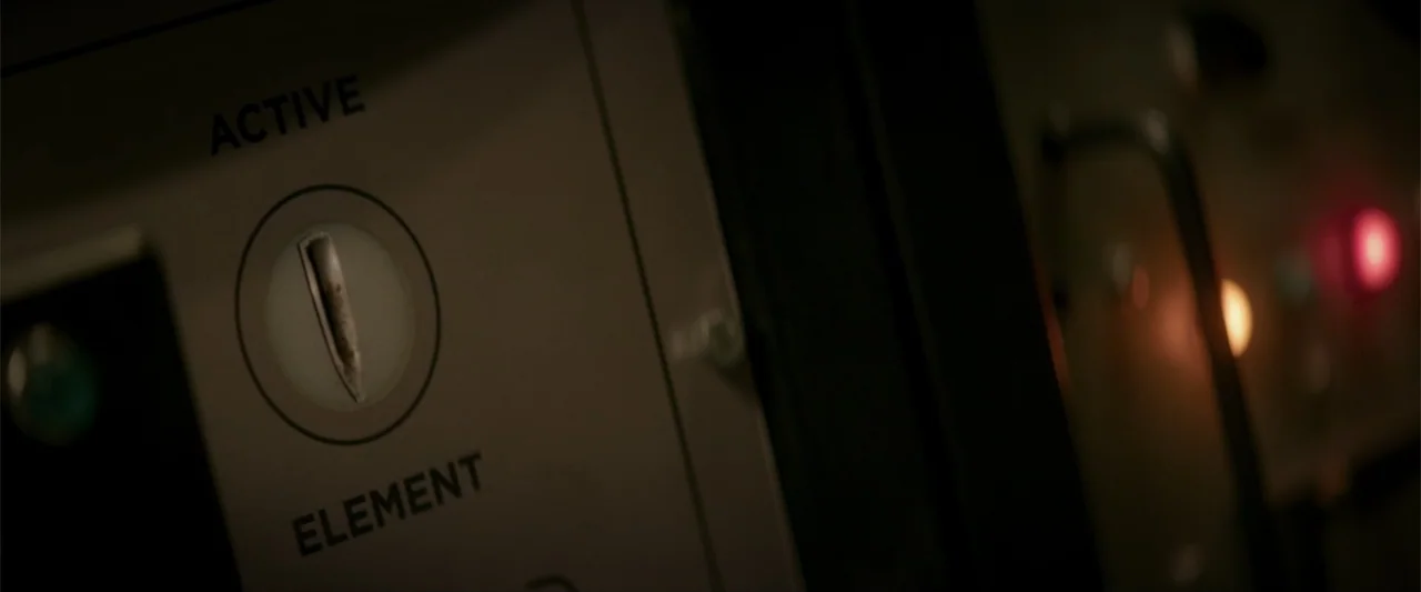 Treblinka's Last Witness (2012) movie still: closeup — A close up of a control panel with the words active and element printed. An illuminated…