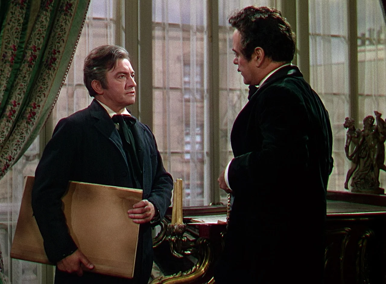 Phantom of the Opera (1943) movie still: medium — An interior space features large floor-to-ceiling windows with sheer curtains and ornate decor.…
